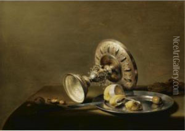 A Still Life With An Overturned 
Silver Tazza, A Silver Plate With A Partly Peeled Lemon And An Olive, 
With Walnuts And Hazelnuts On A Table Draped With A Green Cloth Oil Painting - Pieter Claesz.