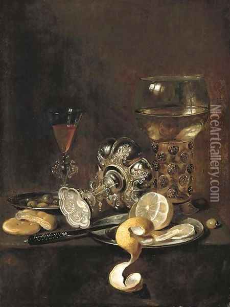 A giant roemer, an upturned goblet, a glass, bread, a knife and a partly-peeled lemon on a platter, on a table Oil Painting - Pieter Claesz.